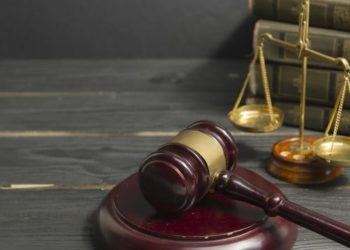 Legal Law concept - Open law book with a wooden judges gavel on table in a courtroom or law enforcement office. Copy space for text Legal Law concept - Open law book with a wooden judges gavel on table in a courtroom or law enforcement office. Copy space for text